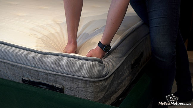 Awara Mattress Reviews: a person testing Awara mattress firmness. Awara Mattress Reviews: a person testing Awara mattress firmness.