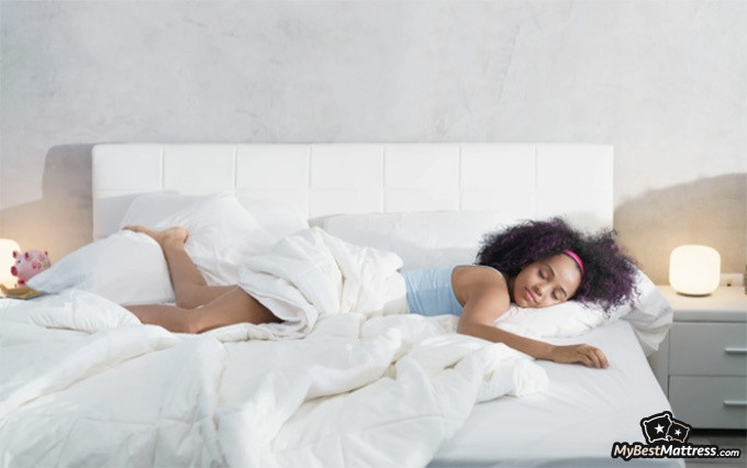 Bear Hybrid mattress review: a woman sleeping. Bear Hybrid mattress review: a woman sleeping.