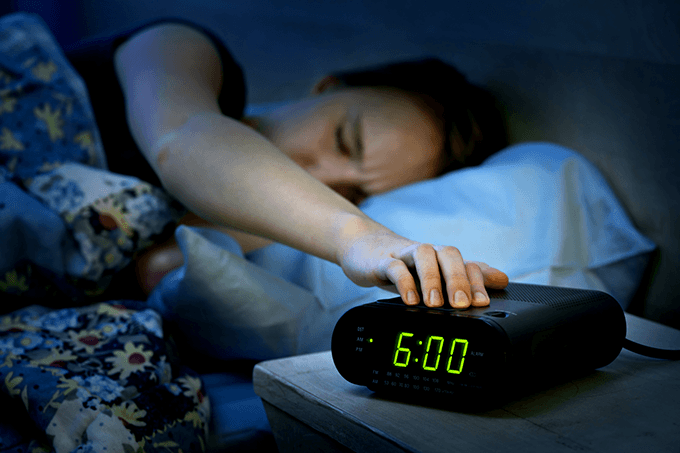 Best alarm clock: a person pressing