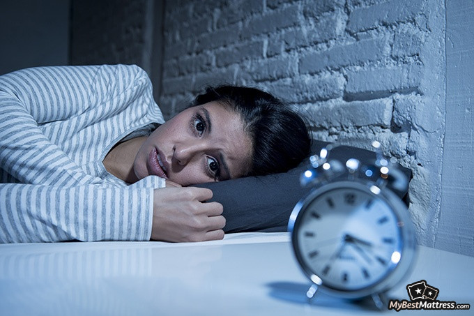 Best Tea For Sleep: Young woman suffering from sleep anxiety.