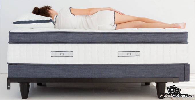 Brentwood Home mattress reviews: a woman is laying on her side on the Oceano mattress, she's seen from her back Brentwood Home mattress reviews: a woman is laying on her side on the Oceano mattress, she's seen from her back