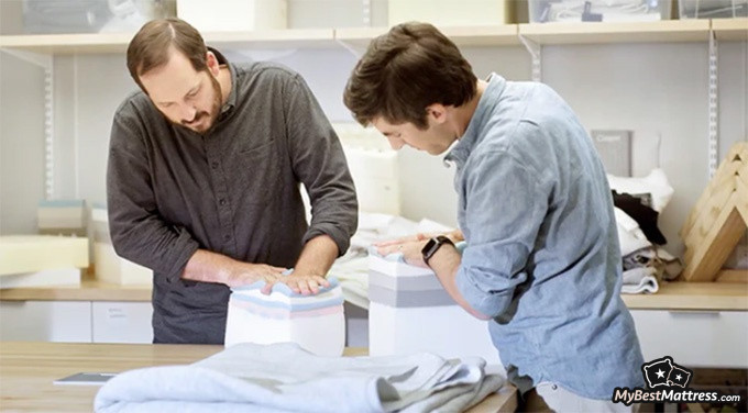Casper Element Review: two men examining the mattress layers.