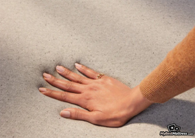 Casper Element Review: testing the firmness of a mattress.