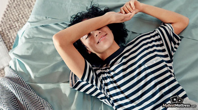 Casper Element Review: woman lying on a casper mattress. Casper Element Review: woman lying on a casper mattress.