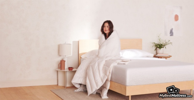 Casper Element Review: woman sitting on a casper mattress. Casper Element Review: woman sitting on a casper mattress.