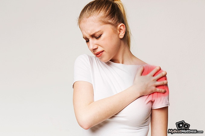 Diamond mattress review: A woman experiencing shoulder pain. Diamond mattress review: A woman experiencing shoulder pain.