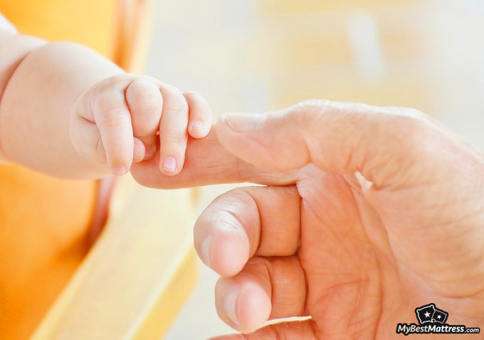 Do Babies Dream: baby holding a finger. Do Babies Dream: baby holding a finger.