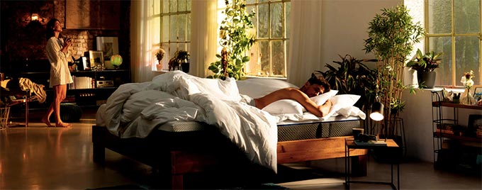 Emma mattress review: a couple on and near the Emma mattress. Emma mattress review: a couple on and near the Emma mattress.