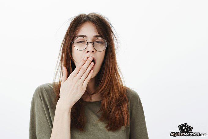 Melatonin and Alcohol: a girl yawning Melatonin and Alcohol: a girl yawning