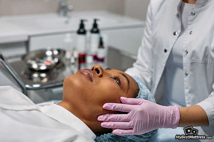 Grinding teeth at night: a woman laying in a doctors office. Grinding teeth at night: a woman lying in a doctors office.