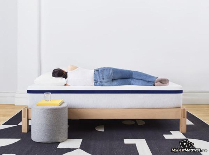 Helix Midnight mattress review: female lying on the side on the Helix Midnight mattress