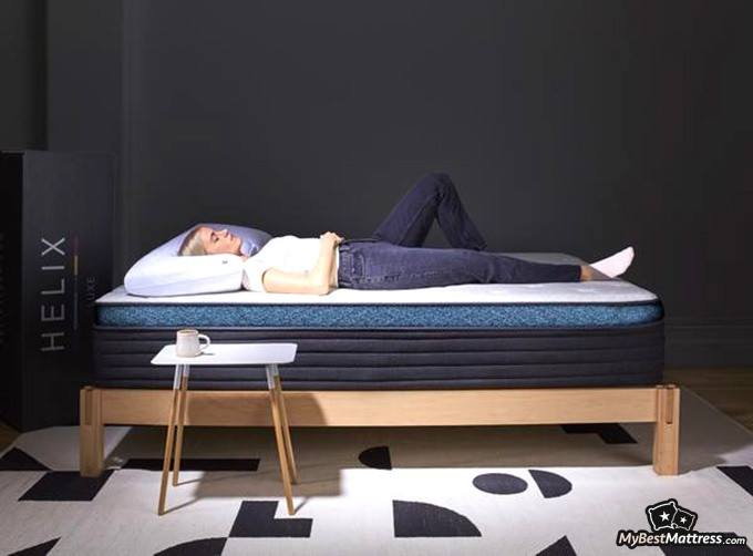 Helix Midnight mattress review: female lying on a Helix Moonlight mattress