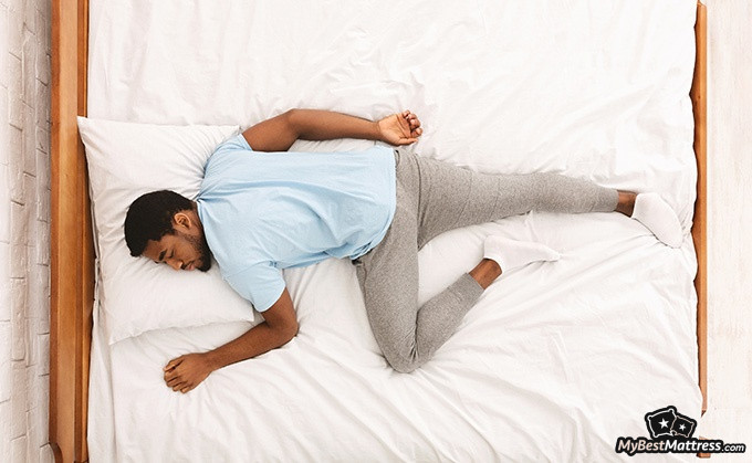 Helix Plus mattress review: a man sleeping on his stomach. Helix Plus mattress review: a man sleeping on his stomach.