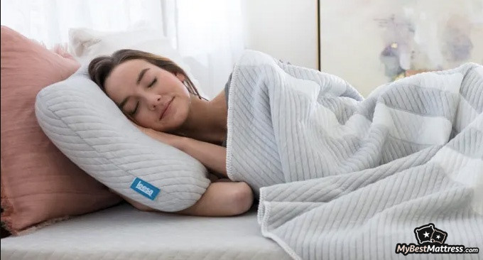 Leesa Hybrid Mattress Review: woman lying on a Leesa pillow. Leesa Hybrid Mattress Review: woman lying on a Leesa pillow.