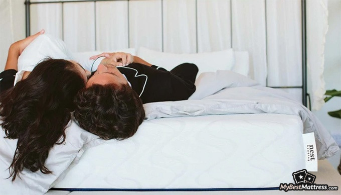 Love & Sleep mattress review: a couple is lying on the Nest Love and Sleep mattress Love & Sleep mattress review: a couple is lying on the Nest Love and Sleep mattress