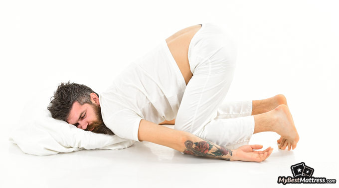 Knee pillow: man sleeping on pillow, on knees.