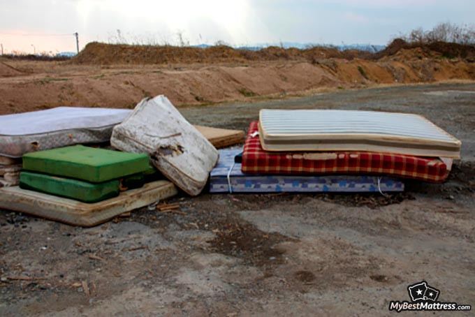 Mattress disposal: a pile of old mattresses. Mattress disposal: a pile of old mattresses.
