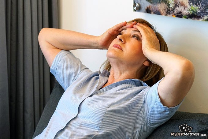 Magnesium for sleep: a woman with a headache.