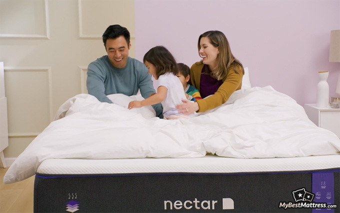 Nectar Premier Mattress Reviews: a family playing in bed.