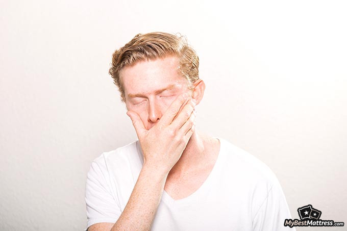 Night terrors in adults: a man yawning.