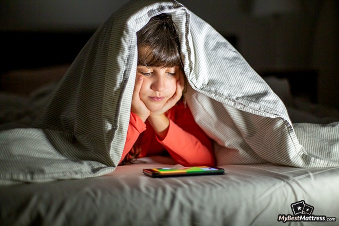 Night terrors vs nightmares: a child is under a blanket Night terrors vs nightmares: a child is under a blanket