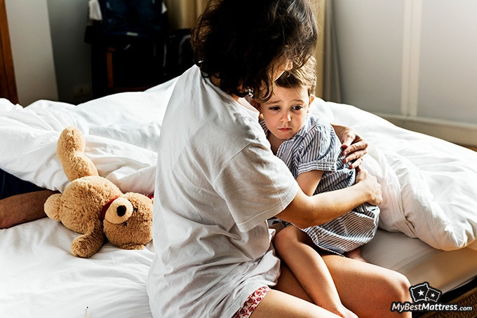 Night terrors vs nightmares: a mother is consoling her child Night terrors vs nightmares: a mother is consoling her child