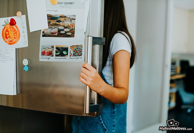 Night terrors vs nightmares: a woman is looking inside a fridge Night terrors vs nightmares: a woman is looking inside a fridge