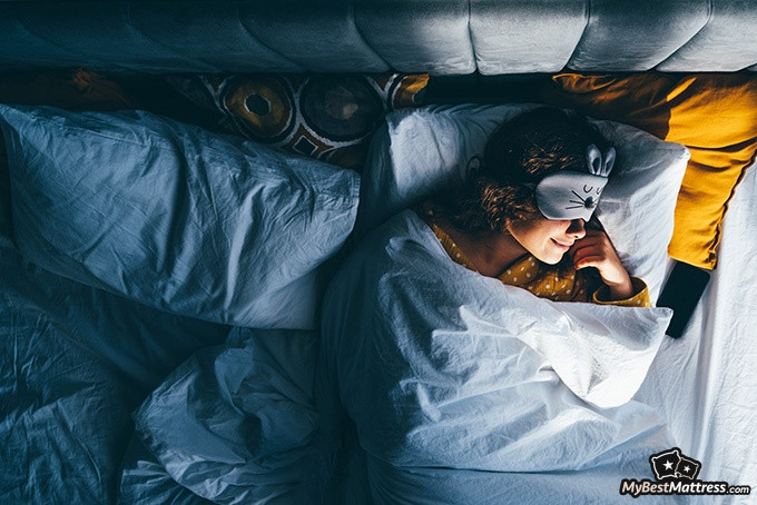 Night terrors vs nightmares: a woman is wearing a sleep mask Night terrors vs nightmares: a woman is wearing a sleep mask