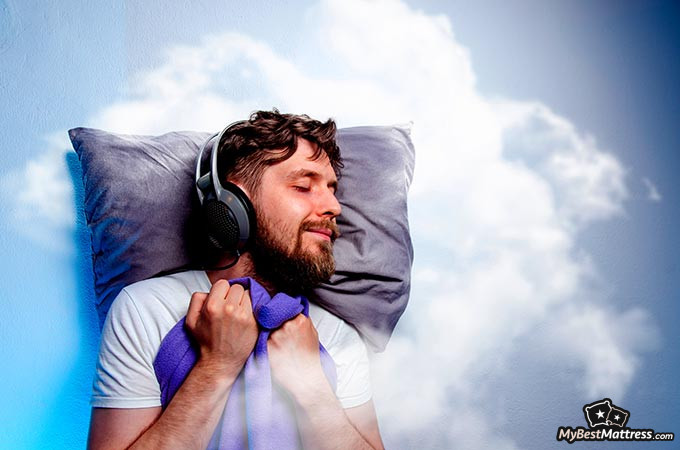 Noise-canceling headphones for sleeping: a man sleeping with headphones on.