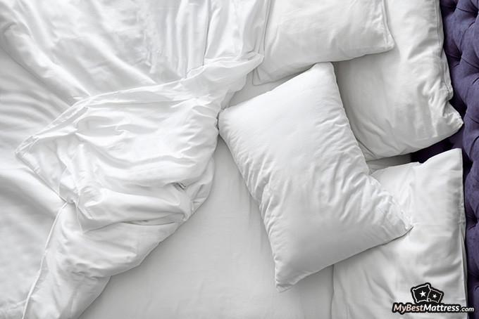 Side Sleeper: lots of pillows in bed Side Sleeper: lots of pillows in bed.