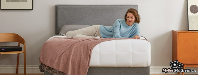 Purple Hybrid mattress review: a woman lying on her Purple mattress. Purple Hybrid mattress review: a woman lying on her Purple mattress.