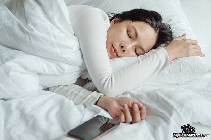 Purple Hybrid mattress review: a woman sleeping. Purple Hybrid mattress review: a woman sleeping.