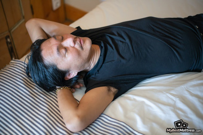 Sleep hallucinations: male sleeping on his back Sleep hallucinations: male sleeping on his back