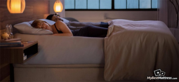 Sleep Number P6 Reviews: a man and a woman sleeping on their bed.