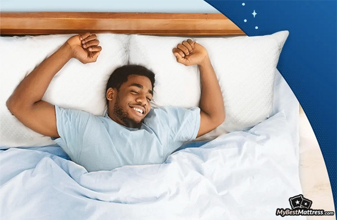 Snuggle-Pedic mattress review: a man is sleeping on the Snuggle-Pedic mattress and pillows Snuggle-Pedic mattress review: a man is sleeping on the Snuggle-Pedic mattress and pillows