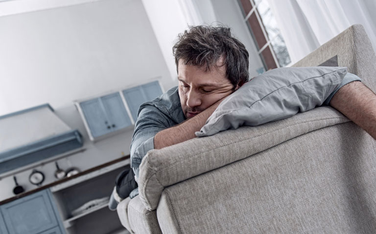 Sleeping too much: tired man asleep Sleeping too much: tired man asleep