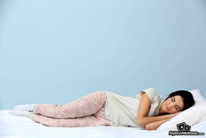 Tuft and Needle pillow review: a woman sleeping on a light pillow. Tuft and Needle pillow review: a woman sleeping on a light pillow.