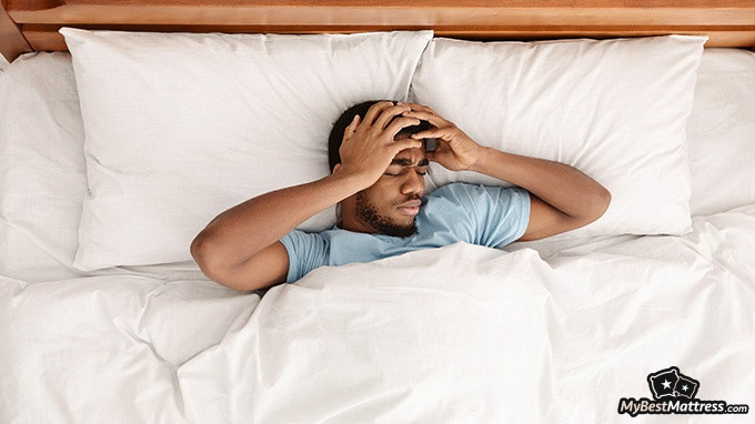 What is Parasomnia: a man is sleeping restlessly What is Parasomnia: a man is sleeping restlessly