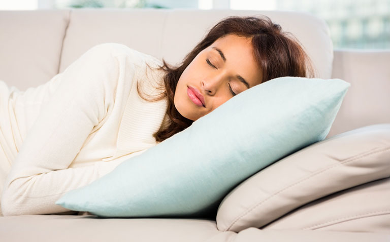 How long should I nap: a woman napping on a sofa How long should I nap: a woman napping on a sofa