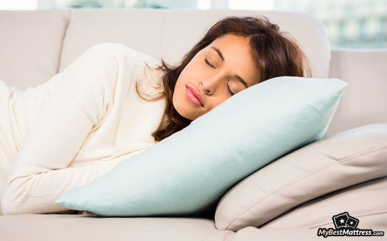How long should I nap: a woman napping on a sofa How long should I nap: a woman napping on a sofa