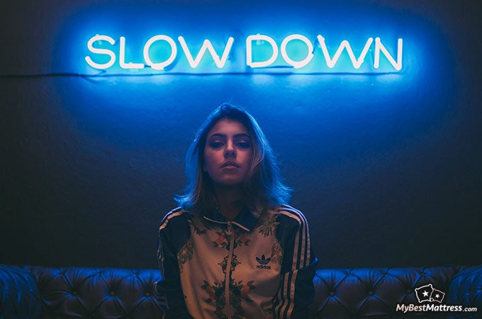 Nausea in the morning: woman sitting on sofa. Nausea in the morning: woman sitting on sofa.