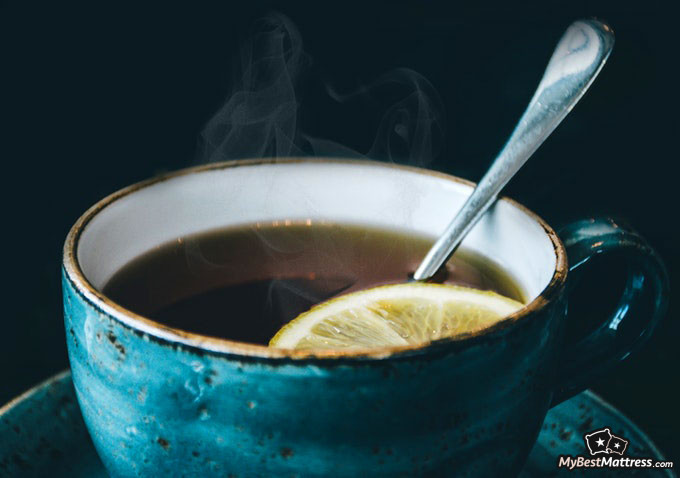 Working out before bed: Tea with lemon in a cup. Working out before bed: Tea with lemon in a cup.
