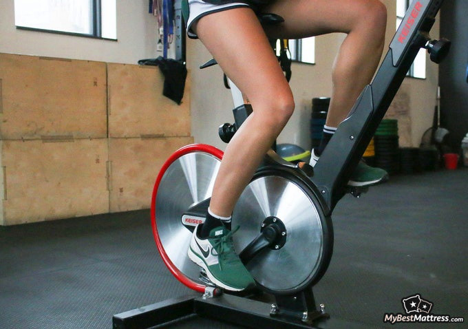 Working Out Before Bed: person on a exercise bicycle. Working Out Before Bed: person on a exercise bicycle.