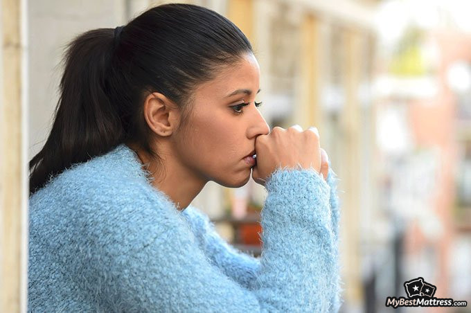 sleep anxiety: worried woman